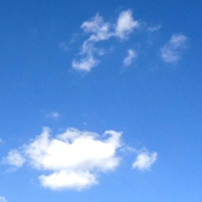 A blue sky with white clouds.