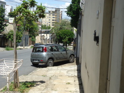 Car parked across the pavement.