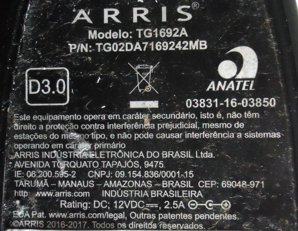 Fine detail of underside label of Arris TG1692A modem SN517309048591
