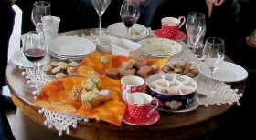 Coffee table with crockery, wine and food to illustrate that objects can be very different from each other.