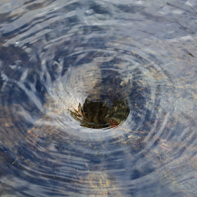 Photo of a whirlpool in water.